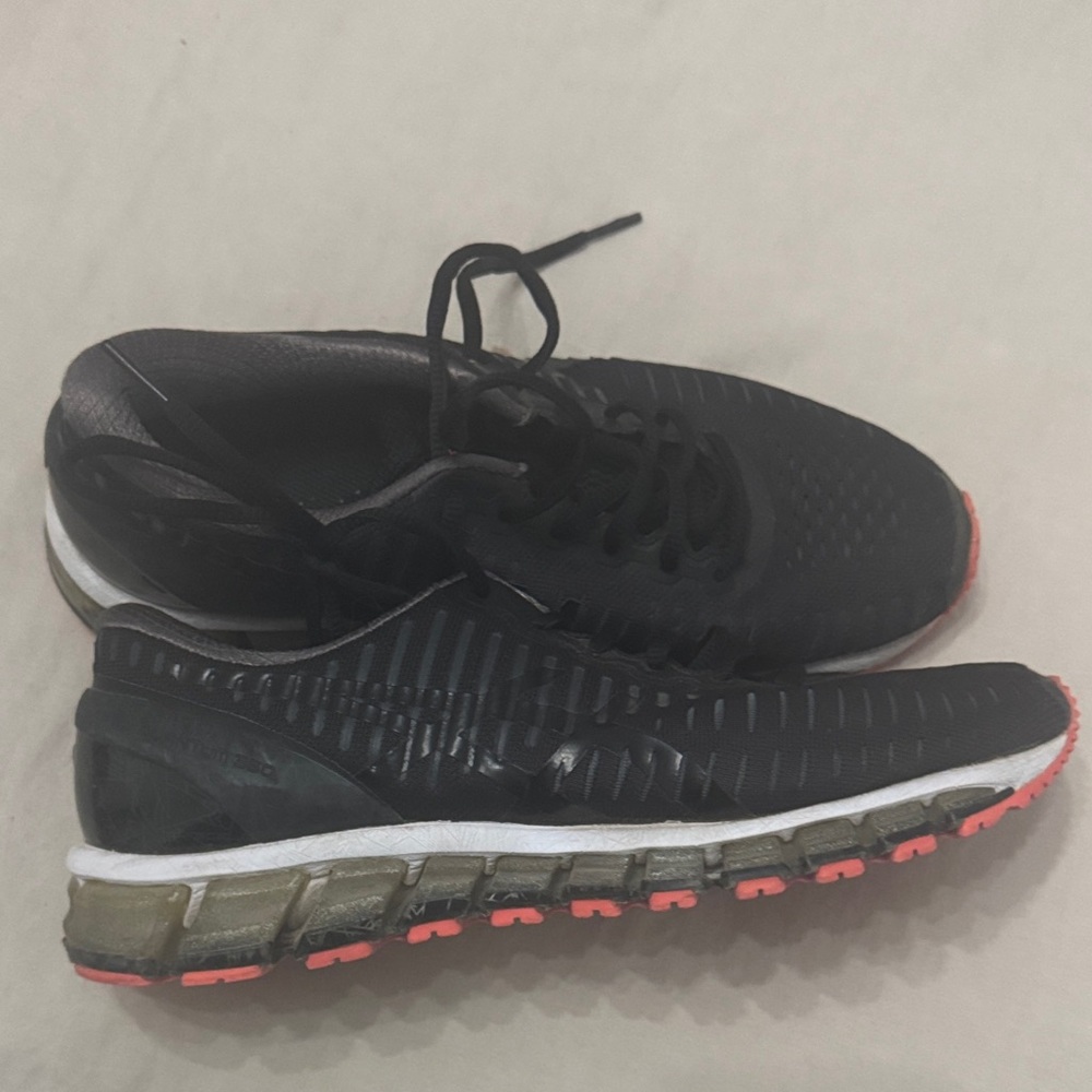Black and orange woman’s Running Shoes